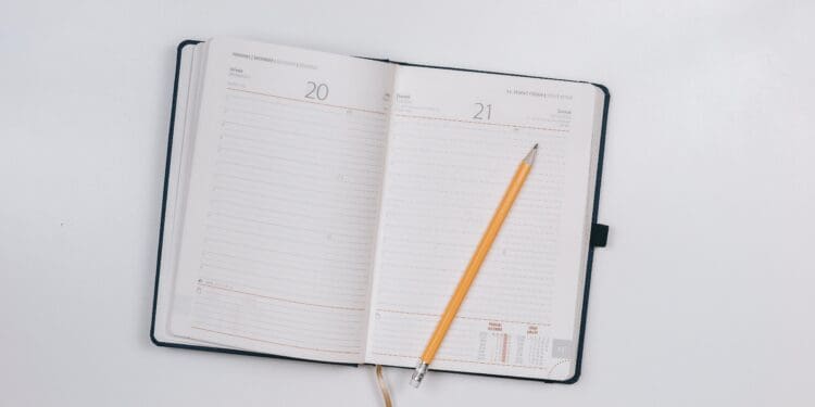 pencil on opened notebook
