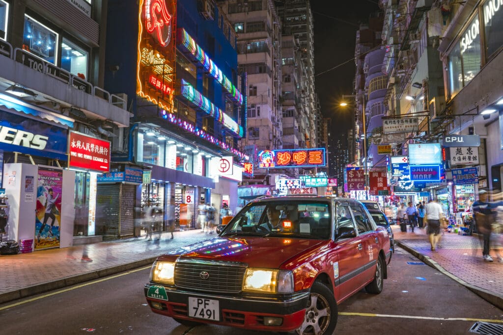 Photo of a red taxi on a street