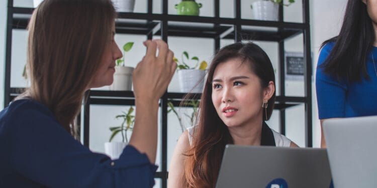 woman sitting in front of laptop