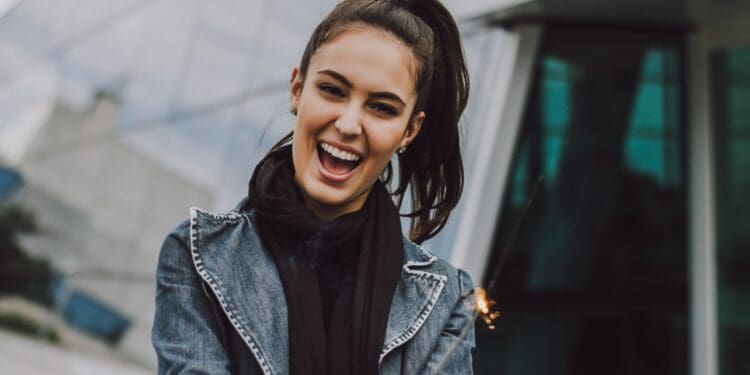 woman wearing gray denim jacket and black scarf
