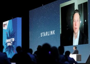 FILE PHOTO: SpaceX founder and Tesla CEO Elon Musk speaks on a screen during the Mobile World Congress (MWC) in Barcelona, Spain, June 29, 2021. REUTERS/Nacho Doce/File Photo