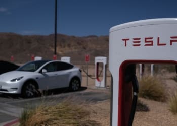 Tesla cars sit at charging stations in Yermo, California, on May 14, 2022. (Photo by Chris Delmas / AFP) (Photo by CHRIS DELMAS/AFP via Getty Images)
