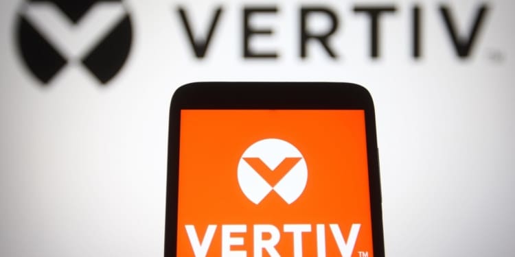 2GF5A2G In this photo illustration, Vertiv Holdings Co logo is seen displayed on a smartphone and a pc screen.