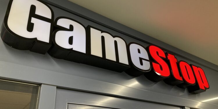 Zug, Switzerland - 6th February 2021 : GameStop logo hanging over a store entrance in Zug, Switzerland. GameStop is an American company that sells video game