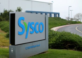 FILE PHOTO: A Sysco sign is shown outside one of their distribution centers in Poway, California, U.S. February 6, 2017. REUTERS/Mike Blake
