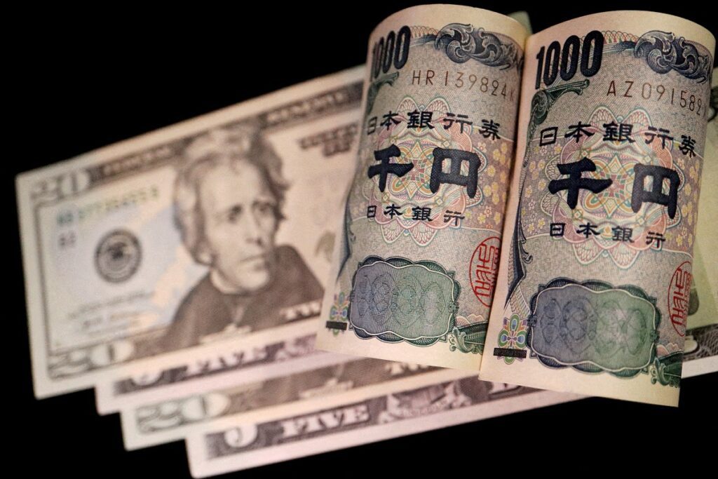 FILE PHOTO: Banknotes of Japanese yen and U.S. dollar are seen in this illustration picture taken September 23, 2022. REUTERS/Florence Lo/File Photo