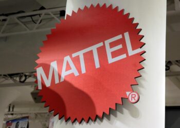FILE - This April 26, 2018, file photo shows the Mattel logo at the TTPM 2018 Spring Showcase in New York. Mattel Inc., helped by the resurgence of Barbie and other iconic toys, on Tuesday, Oct. 29, 2019, reported third-quarter results that handily beat analysts' forecasts and offered evidence that its multiyear turnaround is gaining momentum. (AP Photo/Richard Drew, File)