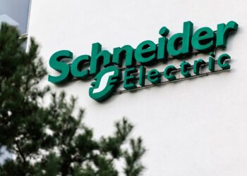 17 December 2025, Bavaria, Garching Bei München: The Schneider Electric logo and lettering can be seen on the headquarters building at the company's German headquarters in Garching near Munich (Bavaria). Schneider Electric SE is a listed electrical engineering group from France. The company is active in the fields of electrical power distribution and industrial automation. (Symbol image, symbol photo, illustration, symbolic photo, illustrative photo, theme image, general image, theme photo) Photo: Matthias Balk/dpa (Photo by Matthias Balk/picture alliance via Getty Images)