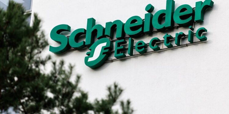 17 December 2025, Bavaria, Garching Bei München: The Schneider Electric logo and lettering can be seen on the headquarters building at the company's German headquarters in Garching near Munich (Bavaria). Schneider Electric SE is a listed electrical engineering group from France. The company is active in the fields of electrical power distribution and industrial automation. (Symbol image, symbol photo, illustration, symbolic photo, illustrative photo, theme image, general image, theme photo) Photo: Matthias Balk/dpa (Photo by Matthias Balk/picture alliance via Getty Images)